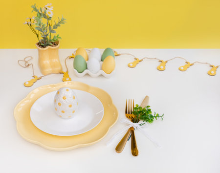 Happy Easter. Easter celebration concept. Top view vertical empty white and yellow plate, Easter eggs, on isolated white background. Copy space, place for text, banner.の写真素材