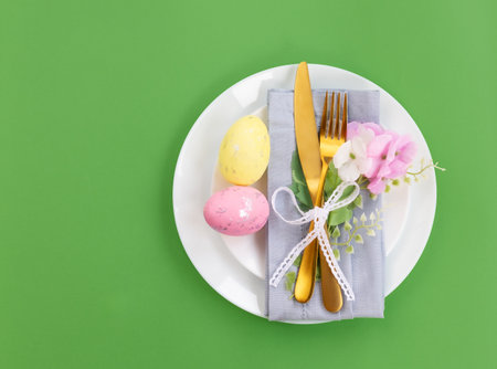Happy Easter. Easter celebration concept. Top view vertical Napkin empty white and yellow plate,...