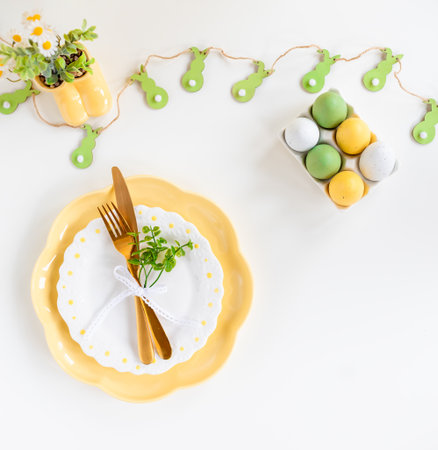 Happy Easter. Easter celebration concept. Top view vertical empty dishes Easter eggs, on isolated...