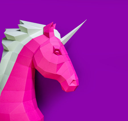 Geometric Pink Unicorn Sculpture Dual Background. Bold and modern geometric unicorn sculpture in pink white stands against split pink purple background, blending fantasy with minimalistic design.の写真素材