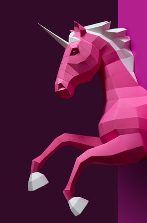 Geometric Pink Unicorn Sculpture Dual Background. Bold and modern geometric unicorn sculpture in pink white stands against split pink purple background, blending fantasy with minimalistic design.の写真素材