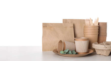 Set of disposable eco friendly dishware on white background