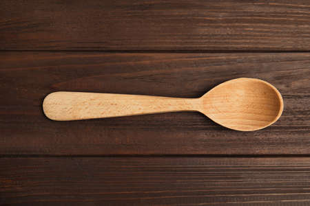 Handmade wooden spoon on rustic table, top viewの写真素材