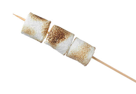 Stick with roasted marshmallows isolated on whiteの写真素材