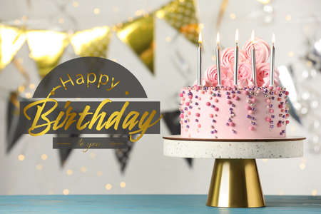 Happy Birthday! Delicious cake on blue wooden table