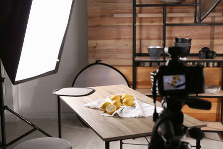 Professional equipment and many lemons on table in studio. Food photoの写真素材