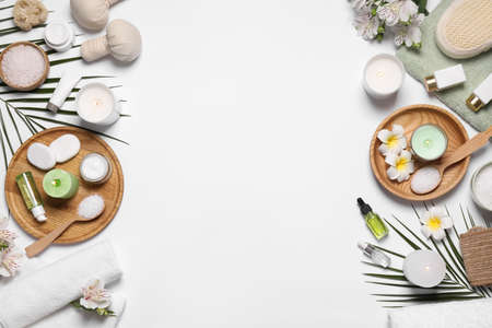 Flat lay composition with spa essentials on white background. Space for text