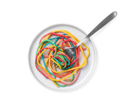 Colorful sweet gummy strings served as spaghetti on white background, top view. April Fools' Dayの写真素材