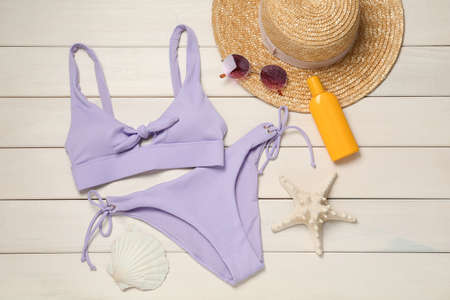 Flat lay composition with beach accessories on white wooden backgroundの写真素材