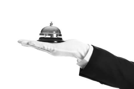 Butler holding service bell on white background, closeupの写真素材