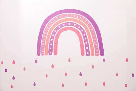 Creative painting of rainbow on white wallの写真素材
