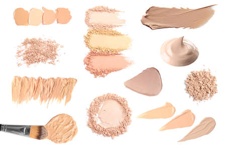 Set with different liquid foundation and face powder on white backgroundの写真素材
