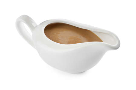 Delicious turkey gravy in sauce boat isolated on whiteの写真素材