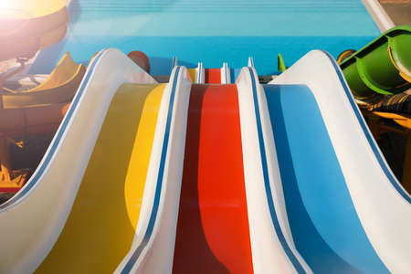 Colorful slides in water park on sunny dayの写真素材