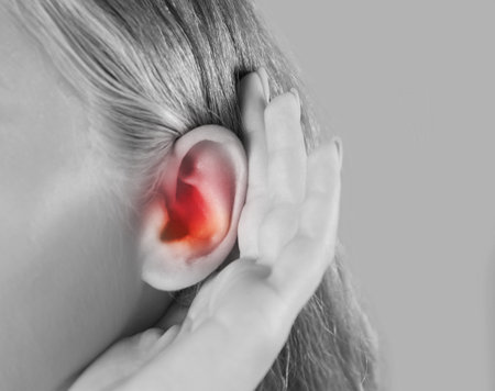 Woman suffering from earache, closeup. Black and white toneの写真素材