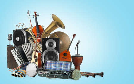 Group of different musical instruments on light blue background