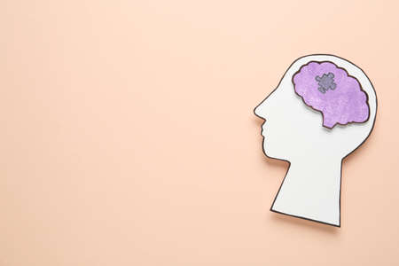 Top view of human head cutout with brain on beige background, space for text. Epilepsy awarenessの写真素材