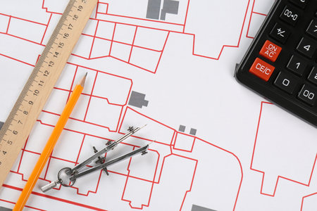 Office stationery on cadastral map of territory with buildings, flat lay