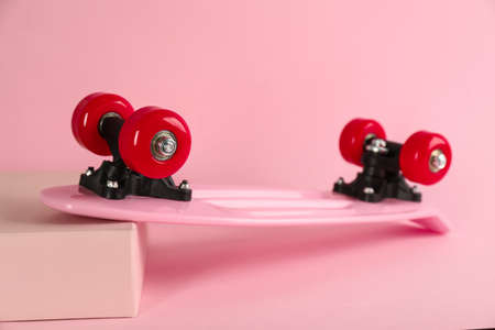 Pink skateboard on color background. Sport equipmentの写真素材