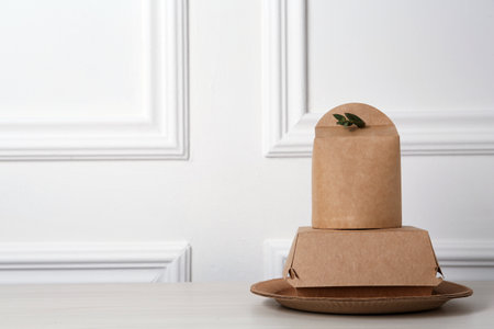 Disposable eco friendly products on white wooden table. Space for textの写真素材