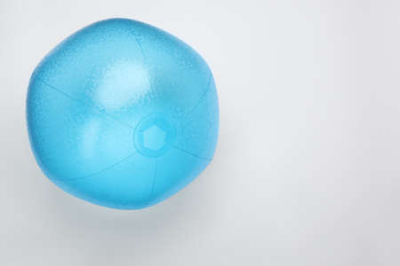 Light blue beach ball on white background, top view. Space for textの写真素材