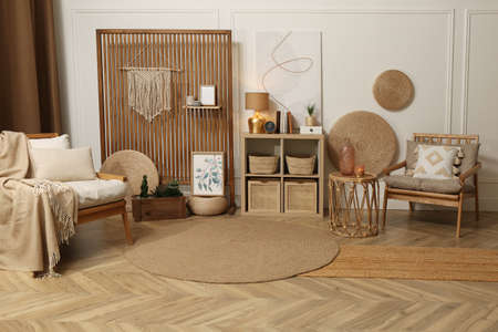 Stylish living room interior with ethnic boho decorの写真素材