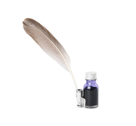 Feather pen and bottle of ink on white backgroundの写真素材