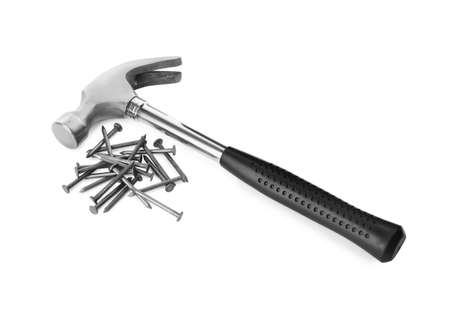 Hammer and metal nails on white backgroundの写真素材