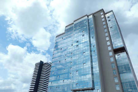 Low angle view of modern city buildings against sky
