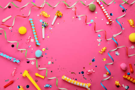Frame made with carnival items on pink background, flat lay. Space for textの写真素材