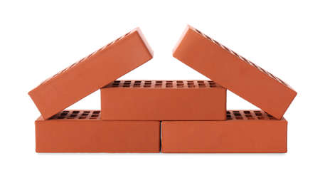 Many red bricks on white background. Building materialの写真素材