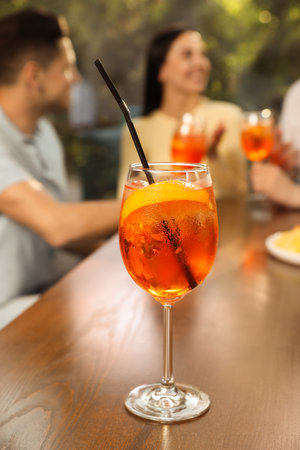 Friends spending time together at cafe, focus on cocktailの写真素材
