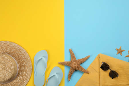 Flat lay composition with beach objects on color background, space for text