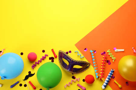 Flat lay composition with carnival items on color background. Space for textの写真素材