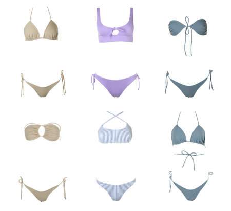 Collection of different stylish bikini on white backgroundの写真素材