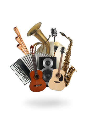Group of different musical instruments on white background