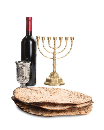Tasty matzos, wine and menorah on white background. Passover (Pesach) celebration