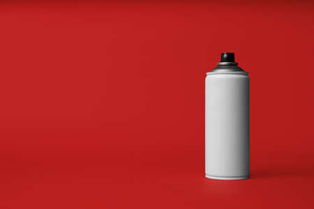 Can of spray paint on red background, space for text. Graffiti supplyの写真素材