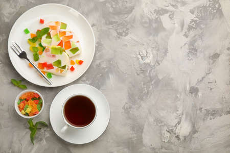 Delicious broken glass jelly dessert on white marble table, flat lay. Space for textの写真素材