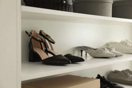 Storage rack with stylish women's shoes and accessoriesの写真素材