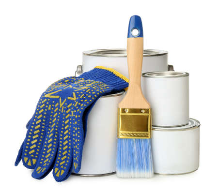 Closed blank cans of paint, gloves and brush isolated on white
