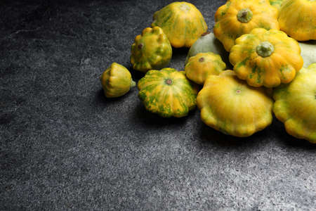 Fresh ripe pattypan squashes on gray table. Space for textの写真素材