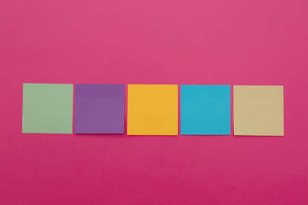 Colorful sticky notes on pink background, flat lay