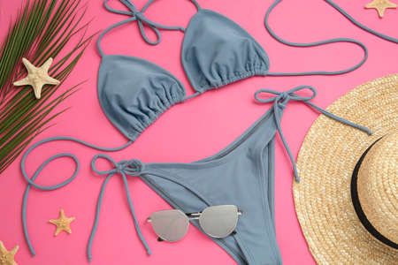 Flat lay composition with stylish bikini on pink backgroundの写真素材