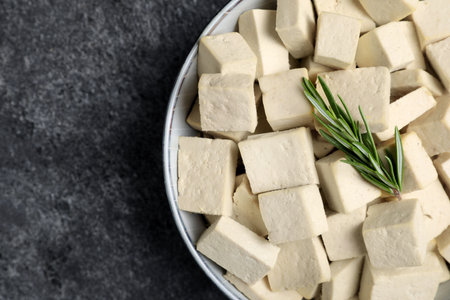 Delicious tofu with rosemary on gray table, top viewの写真素材