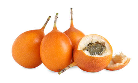 Whole and cut delicious granadillas on white background