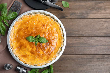 Delicious pie with minced meat on wooden table, flat lay. Space for text