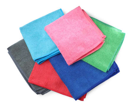 Colorful microfiber cloths on white background, top view