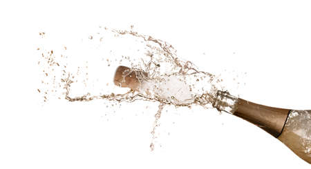 Sparkling wine splashing out of bottle on white backgroundの写真素材