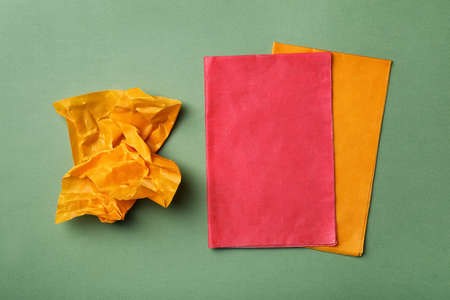 Colorful beeswax food wraps on light green background, flat layの写真素材